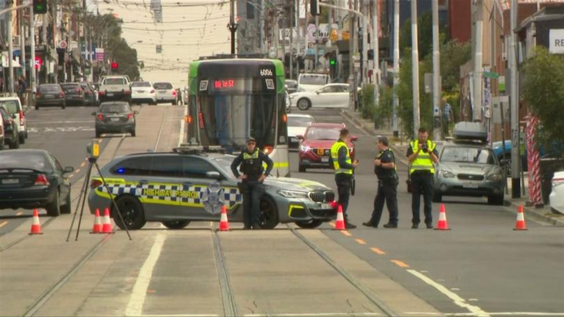 A woman is fighting for life after being hit by a car on a busy road in Thornbury, Melbourne.