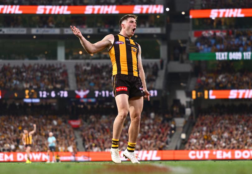 Dylan Moore celebrates kicking a goal against Essendon.