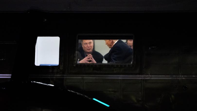 Elon Musk speaks with President Donald Trump aboard Marine One as it lands at The White House on March 9. Allison Robbert/For The Washington Post