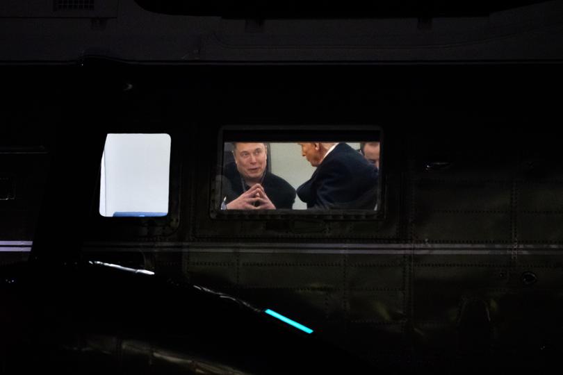 Elon Musk speaks with President Donald Trump aboard Marine One as it lands at The White House on March 9. Picture: Allison Robbert/For The Washington Post