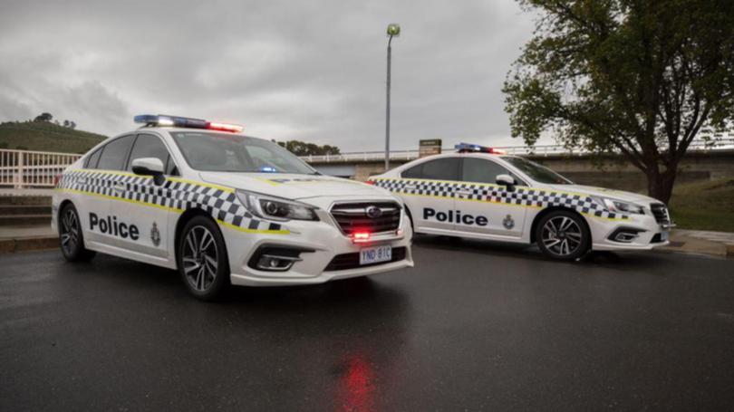 ACT police arrested the motorbike rider for doing burnouts in the carpark of a police station.