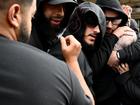 Sarah Abu Lebdeh (centre, pale scarf) was surrounded by supporters as she left court. (Bianca De Marchi/AAP PHOTOS)