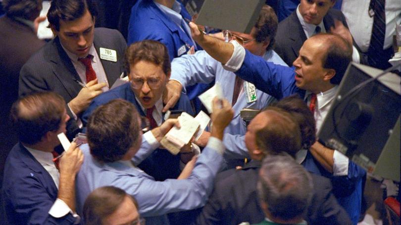 Traders on the floor of the New York Stock Exchange work frantically as panic selling swept Wall Street in this Oct. 19, 1987.