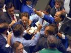 Traders on the floor of the New York Stock Exchange work frantically as panic selling swept Wall Street in this Oct. 19, 1987.