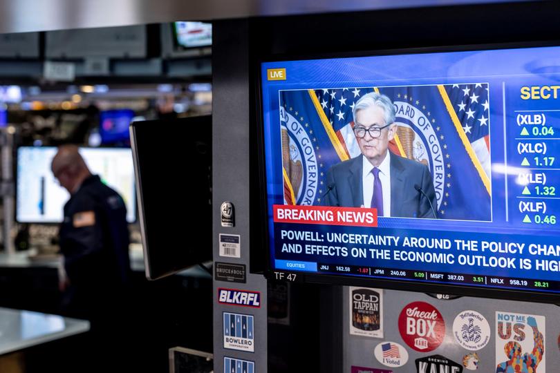 A screen at the New York Stock Exchange shows US Federal Reserve Chairman Jerome Powell discussing the Fed’s decision to leave interest rates on hold.