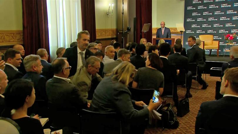 A person is removed by security during the Opposition Leader Peter Dutton’s address to the Lowy Institute in Sydney, Thursday, March 20, 2025. 