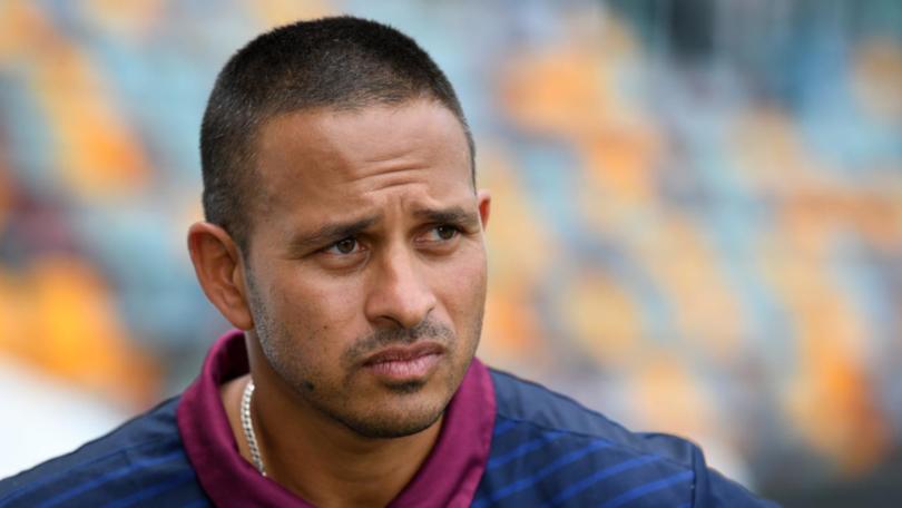 An unhappy Usman Khawaja has responded to comments from Queensland cricket boss Joe Dawes. (Darren England/AAP PHOTOS)