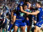 Warriors teammates rush to congratulate Ali Leiataua after one of his tries against the Roosters.  (Brett Phibbs/AAP PHOTOS)