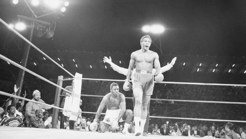 Foreman celebrates his knockout over Frazier. 