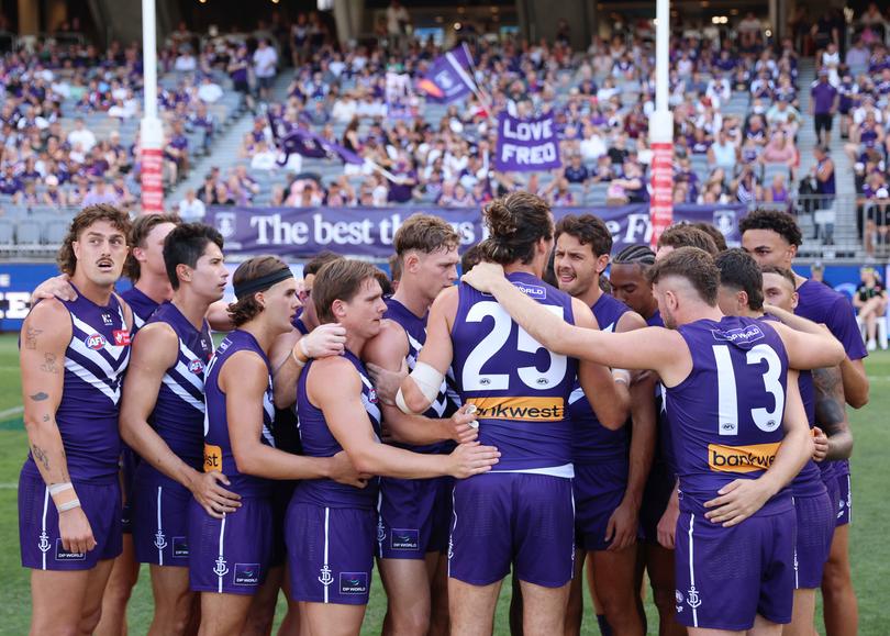 Pearce addresses the huddle.