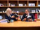 Australian Treasurer Jim Chalmers (right) and Australian Finance Minister Katy Gallagher take a look at the Budget papers.