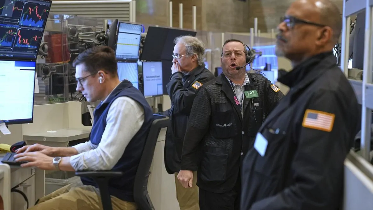 Wall St lower on tariff worries, Nvidia and Tesla drop as world waits ...