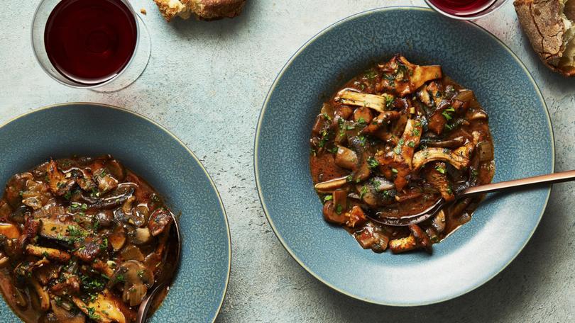 Fresh and wild mushroom stew. David Tanis cooks brown mushrooms with herbs and onions in broth until they create a gravy-like base, which he finishes with some sauted chanterelles. Food styled by Simon Andrews. (Armando Rafael/The New York Times)