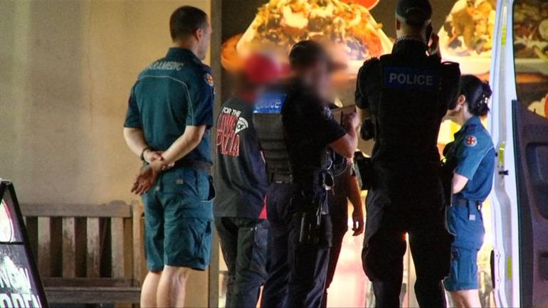 Police are hunting a man who assaulted two women working at a Pizza Hut in Townsville. 