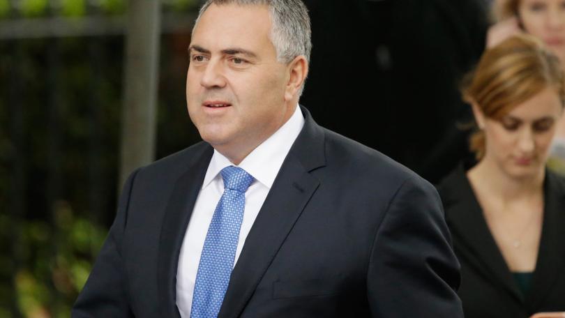 MELBOURNE, AUSTRALIA - MARCH 27: Joe Hockey, the Treasurer of Australia in the Abbott Government arrives at Scots Church during the State Funeral for the Right Honourable Malcolm Fraser on March 27, 2015 in Melbourne, Australia. Malcolm Fraser was the 22nd Prime Minister of Australia and the Leader of the Liberal Party from 1975 to 1983. On 20 March 2015, Fraser died at the age of 84. (Photo by Scott Barbour/Getty Images)