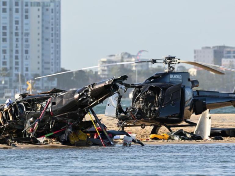 Four tourists died when two helicopters collided near the popular marine theme park. (Dave Hunt/AAP PHOTOS)