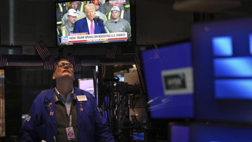 Wall St investors are keeping watch over an escalating US-China tariff war. (AP PHOTO)