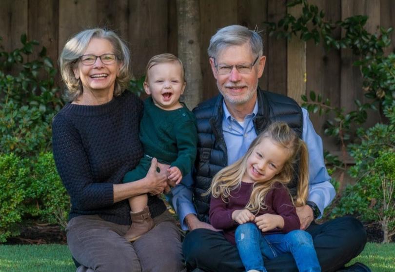 Krehbiel, pictured here with his wife, Amy, and two of their three grandchildren, Miles Krehbiel and Ella Lebovitz, calls adaptive DBS a “game changer in the sense of feeling better day-to-day.”
