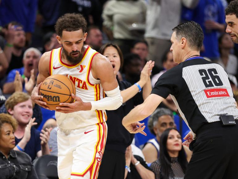 Trae Young stole the ball from a referee as he was ejected.