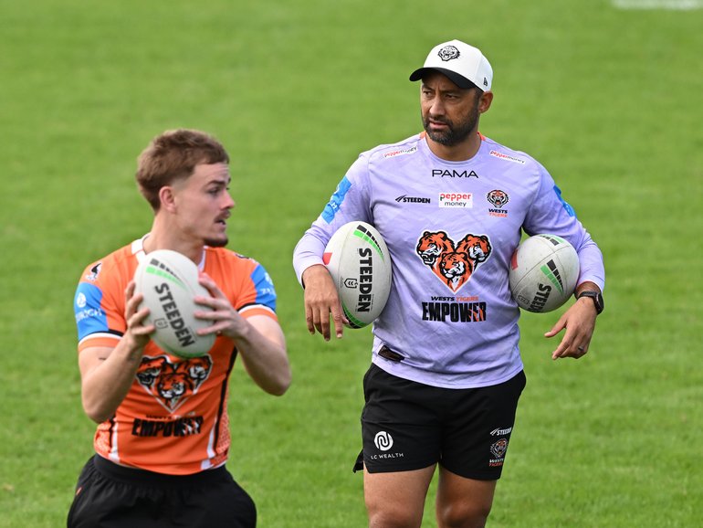 Lachlan Galvin and coach Benji Marshall during Wests Tigers NRL training at Concord Oval on Thursday.