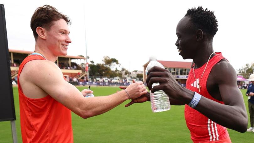 Friendly rivals Lachie Kennedy and Gout Gout celebrate their heat wins at the Stawell Gift.