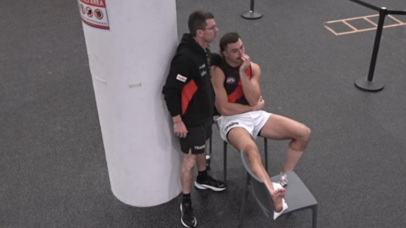 Sam Draper was supported in the rooms by Essendon staffers.