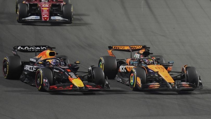 Red Bull's Max Verstappen is beaten to the first corner by McLaren's Oscar Piastri at the Saudi GP. (AP PHOTO)