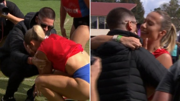 Bree Rizzo celebrates her Stawell Gift triumph with husband and former winner Matt.