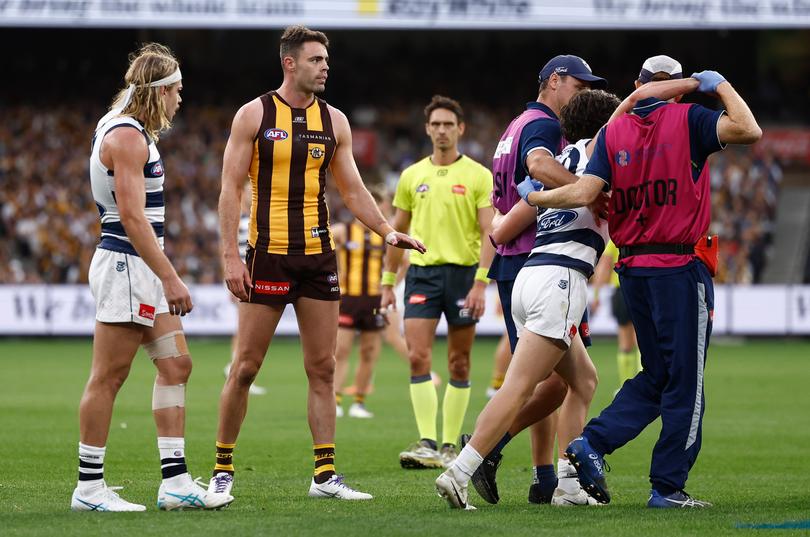 Nash looks on as Miers is helped off.