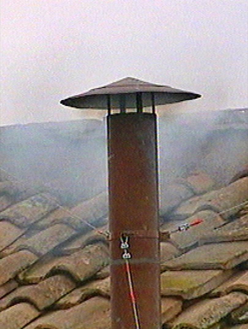 White smoke can be seen coming from the chimney in this frame from TV signalling the election of a new pope at the Vatican in 2005.