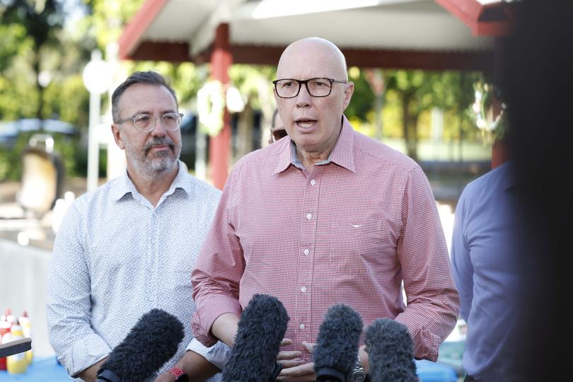 Blair candidate Carl Mutzelburg, and Leader of the Opposition Peter Dutton as he briefly addressed the media at an informal Easter Sunday BBQ in Ipswich in the electorate of Blair outside Brisbane in Queensland.