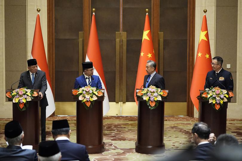 Indonesian Defense Minister Sjafrie Sjamsoeddin, Foreign Minister Sugiono, Chinese Foreign Minister Wang Yi and Defense Minister Dong Jun attend a press briefing after the first meeting of China-Indonesia joint foreign and defense ministerial dialogue at the Diaoyutai State Guest House on April 21, 2025 in Beijing, China. 