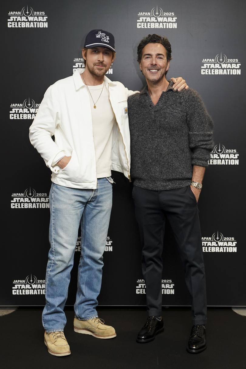 Ryan Gosling and Shawn Levy pose for a photo backstage during Star Wars Celebration.