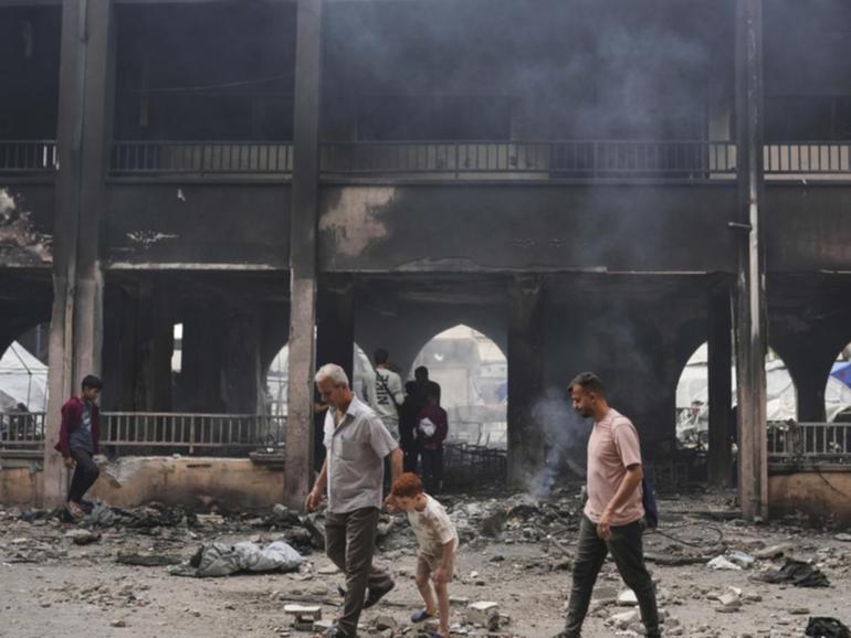At least 10 people were killed in an Israeli strike on a school sheltering families, medics say.