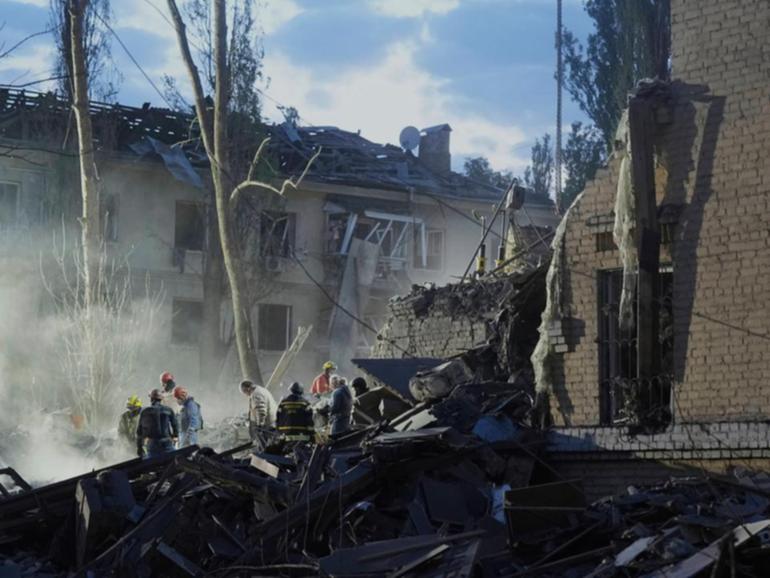 The search continues for bodies and survivors in Kyiv after a Russian attack overnight. (AP PHOTO)