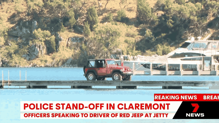 The moment a man drove a car off a jetty and into the Swan River has been caught on camera.