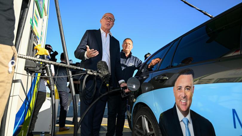 Peter Dutton and Manny Cicchiello, the Liberal candidate for the Division of Aston, visit a petrol station.
