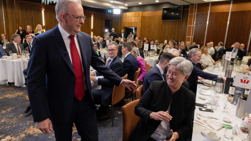  Penny Wong reacts to Anthony Albanese’s approach at the Canberra Press Club in the last week of his election campaign. 