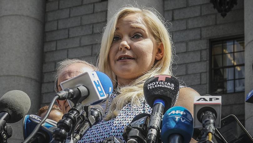 Virginia Roberts Giuffre holds a news conference outside a Manhattan court following jailhouse death of Jeffrey Epstein in 2019.