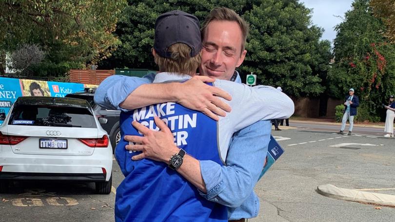 Curtin Liberal candidate Tom White hugs twin brother Nick.