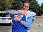 Curtin Liberal candidate Tom White hugs twin brother Nick.