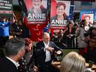 Labor Party and Liberal Party supporters are seen in the background as Australian Prime Minister Anthony Albanese and Labor candidate for Braddon Anne Urquhart visit Rooke Street Mall in the electorate of Braddon on Day 35 of the 2025 federal election campaign, Devonport, Friday, May 2, 2025. (AAP Image/Lukas Coch) NO ARCHIVING