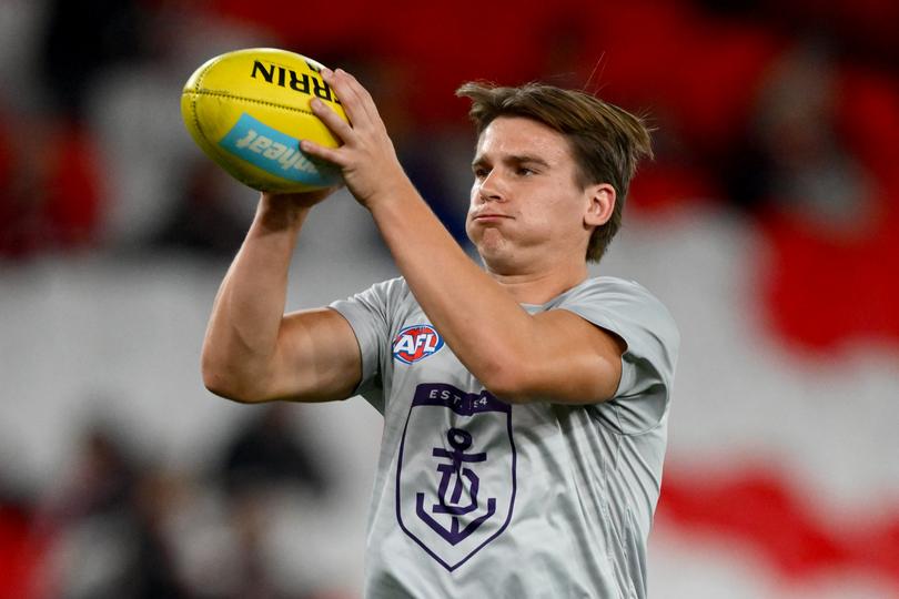 MELBOURNE, AUSTRALIA - MAY 02: Caleb Serong of the Dockers warms up ahead of the round eight AFL match between St Kilda Saints and Fremantle Dockers at Marvel Stadium, on May 02, 2025, in Melbourne, Australia. (Photo by Quinn Rooney/Getty Images)