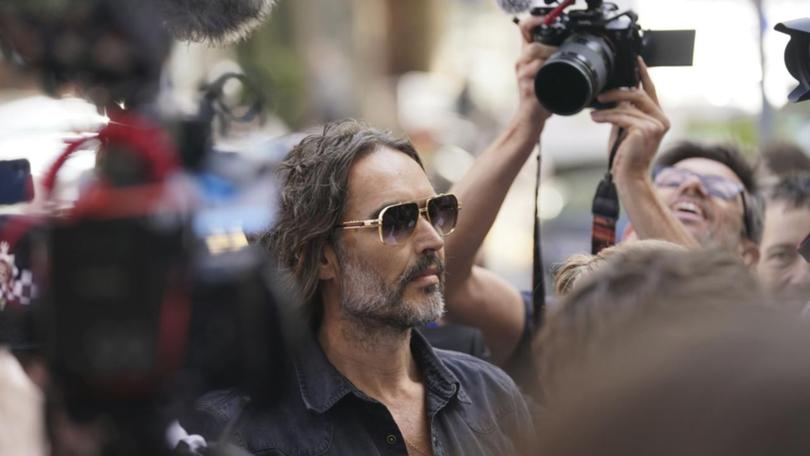 Russell Brand arrived at Westminster Magistrates' court in London to a mass of photographers.