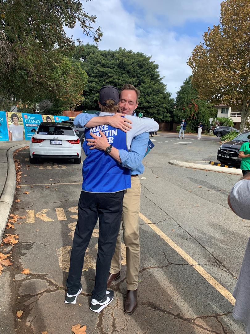 Curtin Liberal candidate Tom White hugs his twin brother Nick,
