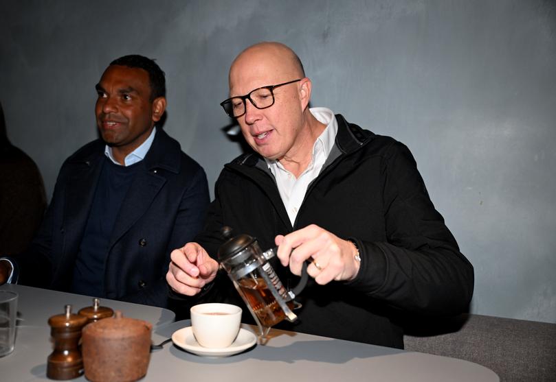 Liberal candidate for Macnamara Benson Saulo and Peter Dutton.