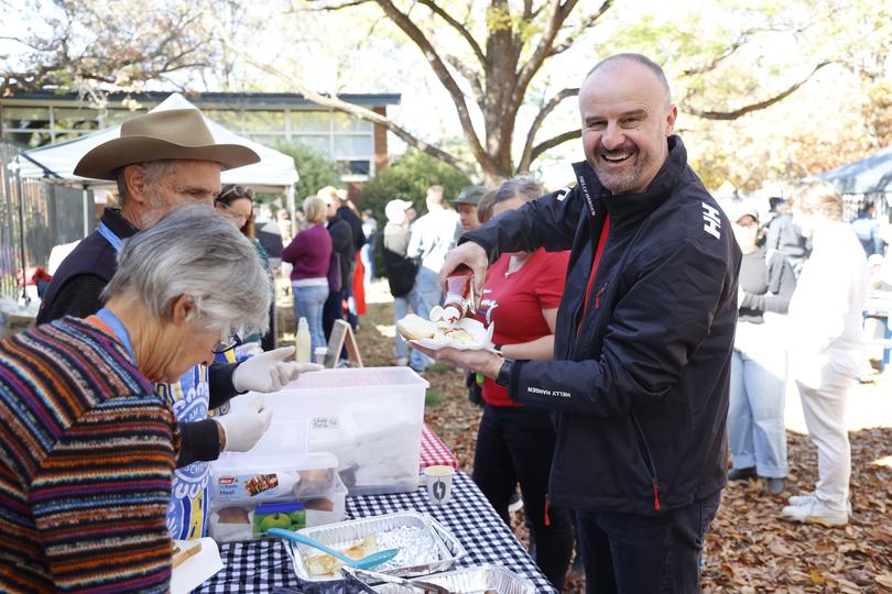 ACT Chief Minister Andrew Barr buys an egg and bacon roll