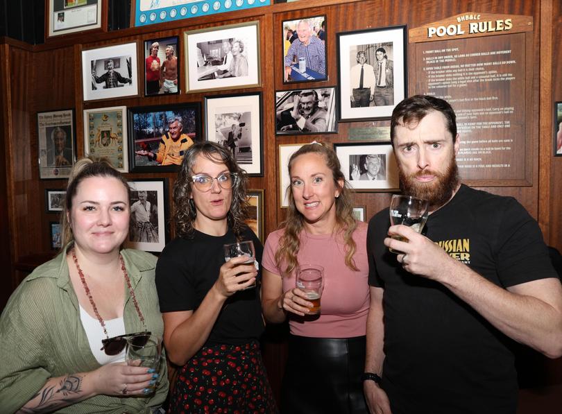 Rachel Wilson, Nicola Lloyd, Danielle Taylor and Trevor Johnson have beers in front of pictures of Bob Hawke at the Bob Hawke Beer and Leisure Centre in Marrickville. 