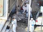 Forensic officers search the spot where a bomb exploded in northern Greece, killing a woman. (AP PHOTO)