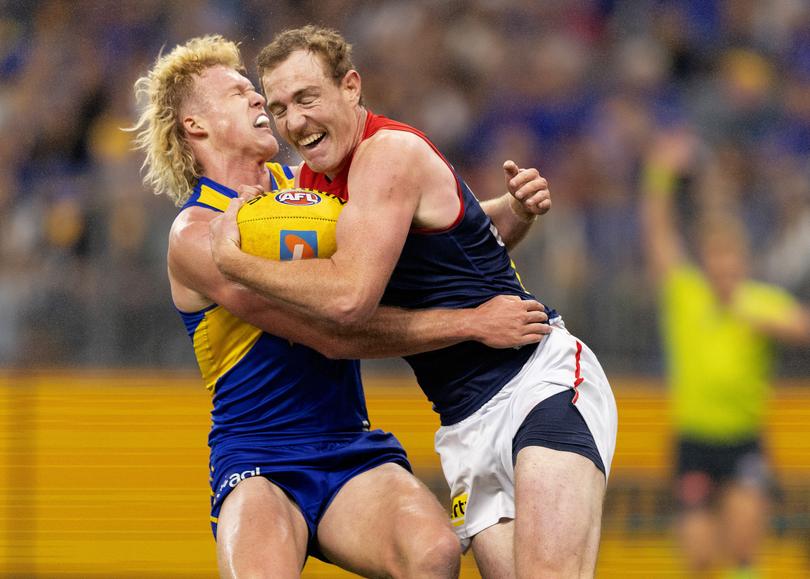 PERTH, AUSTRALIA - MAY 03: Reuben Ginbey of the Eagles recieves a head knock during the 2025 AFL Round 08 match between the West Coast Eagles and the Melbourne Demons at Optus Stadium on May 3, 2025 in Perth, Australia. (Photo by Janelle St Pierre/AFL Photos)